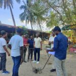 Explaining manual weeders to Rwanda people